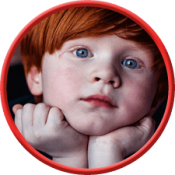 red-head-boy face-on-hands