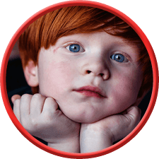 red-head-boy face-on-hands